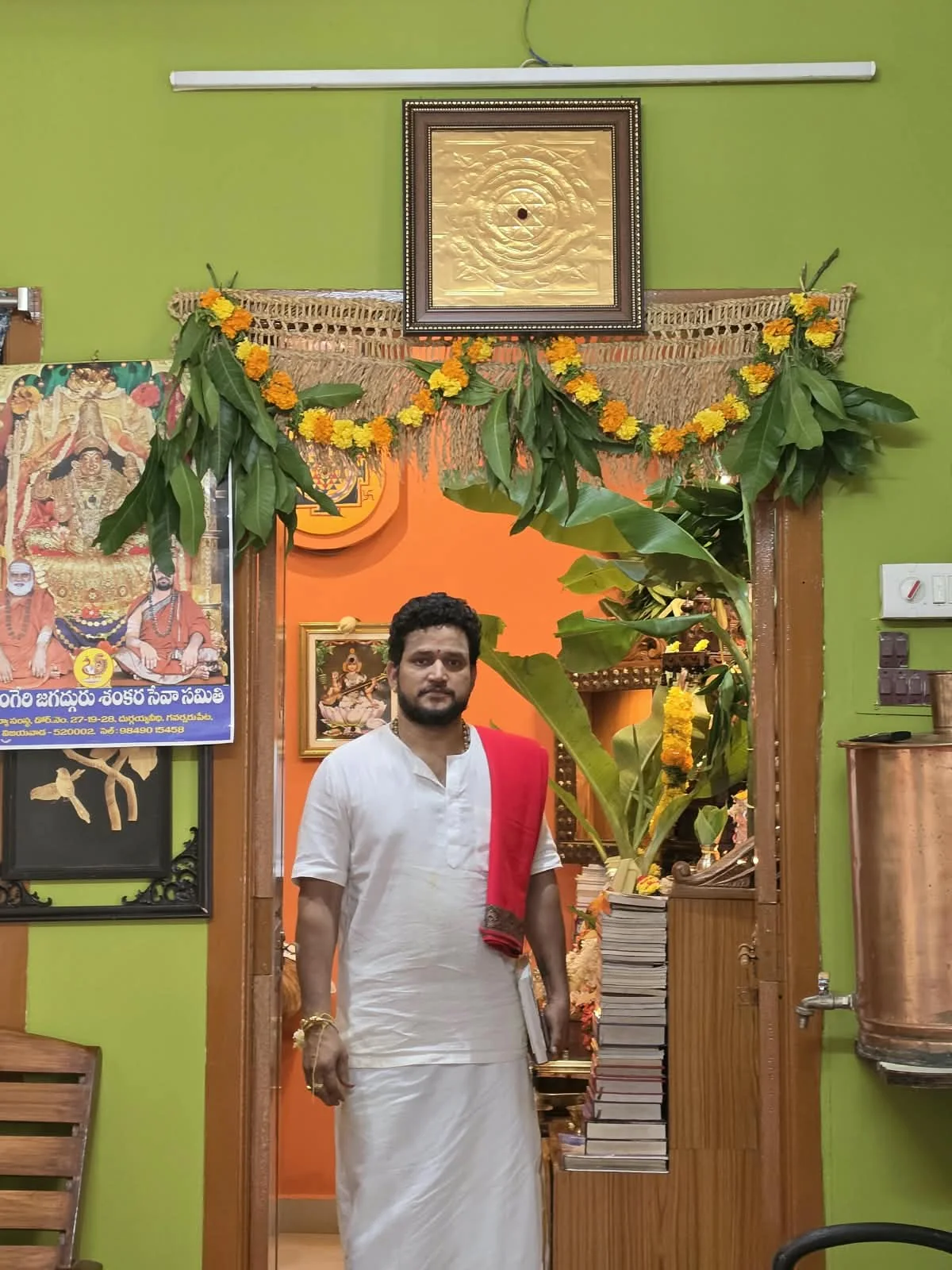 Pandit Hampi Ravishankar Shastri at the decorated office doorway