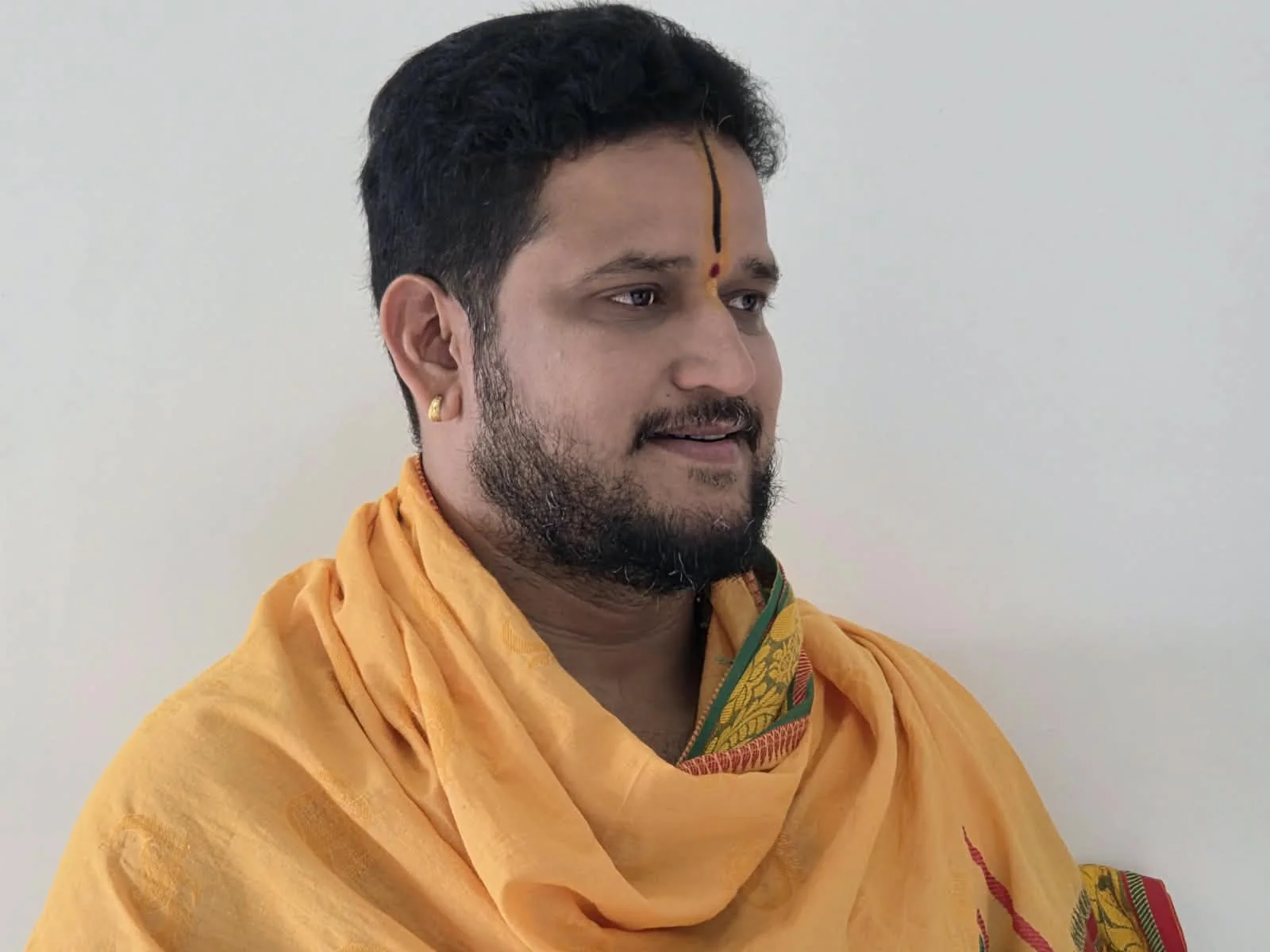 Portrait of Pandit Hampi Ravishankar Shastri in a saffron shawl Portrait of Pandit Hampi Ravishankar Shastri in a saffron shawl